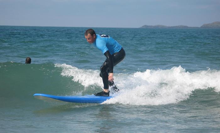 Learning to surf in St Davids Pembrokeshire